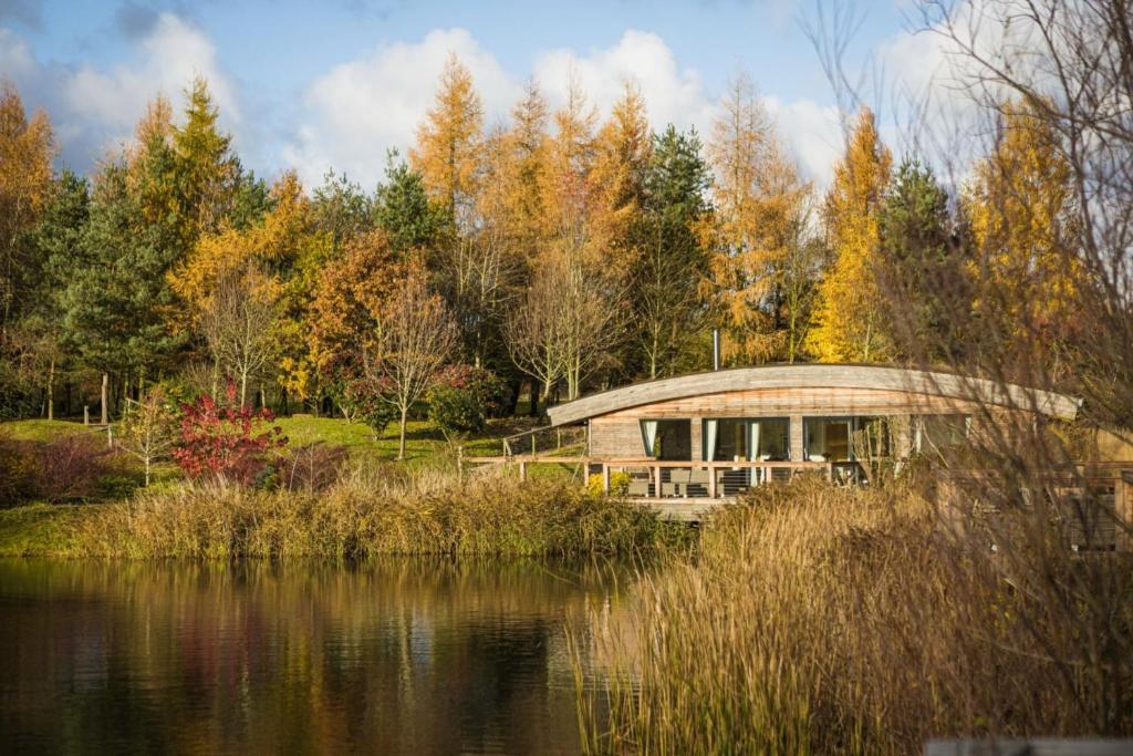 a circular building next to a body of water at Charlie in Richmond