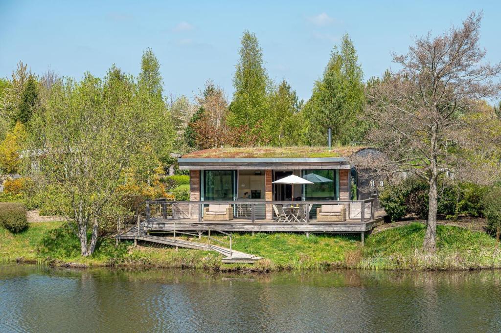 a large house on the edge of a body of water at Finley in Richmond