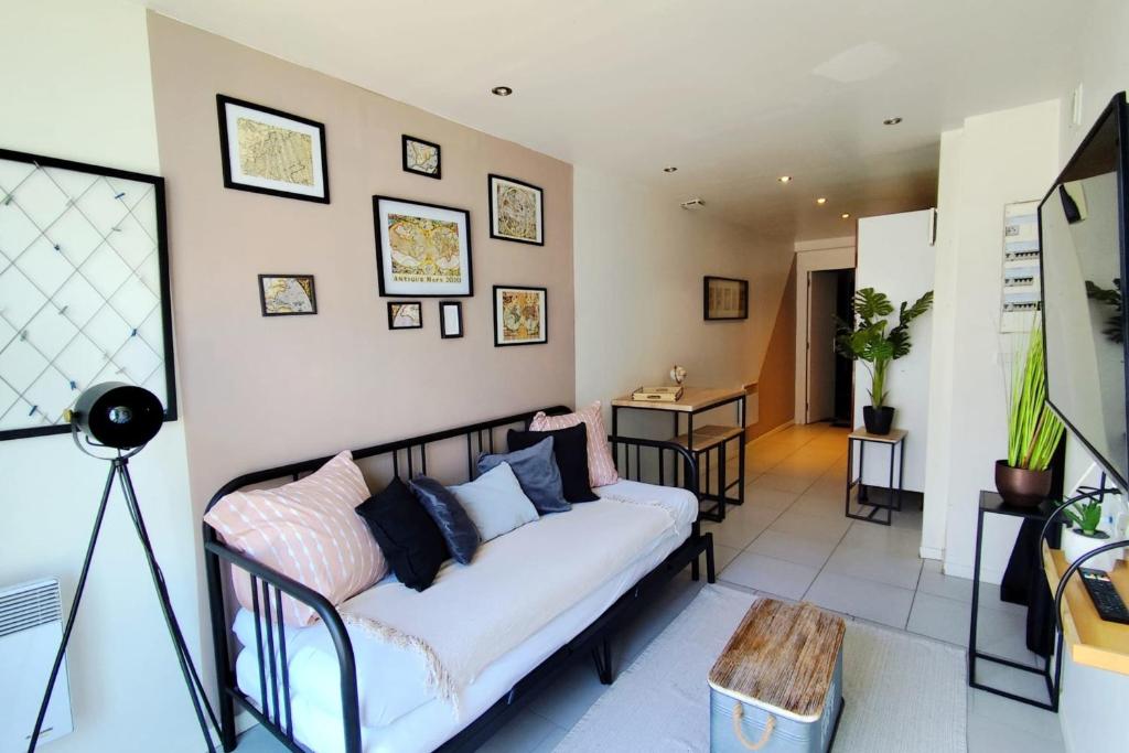 a living room with a couch and a table at Modern in Bègles