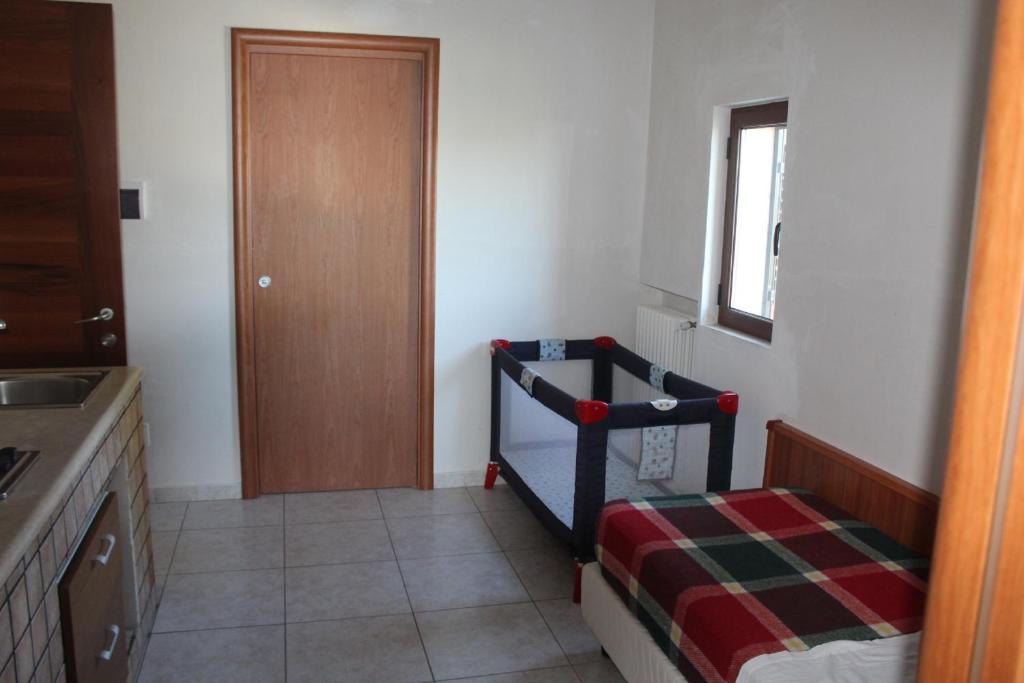 a small room with a bed and a window at Residence Hotel Torresilvana in Vieste