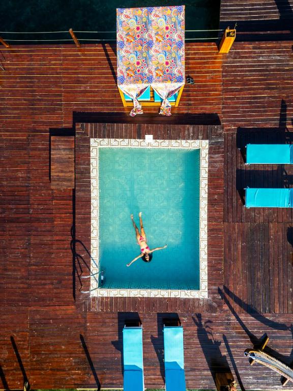 an overhead view of a person in a swimming pool at Coral Wing Casitas in Bastimentos