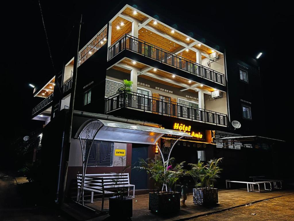 a tall building with a balcony on the side of it at L'Appart des Amis in Antsiranana