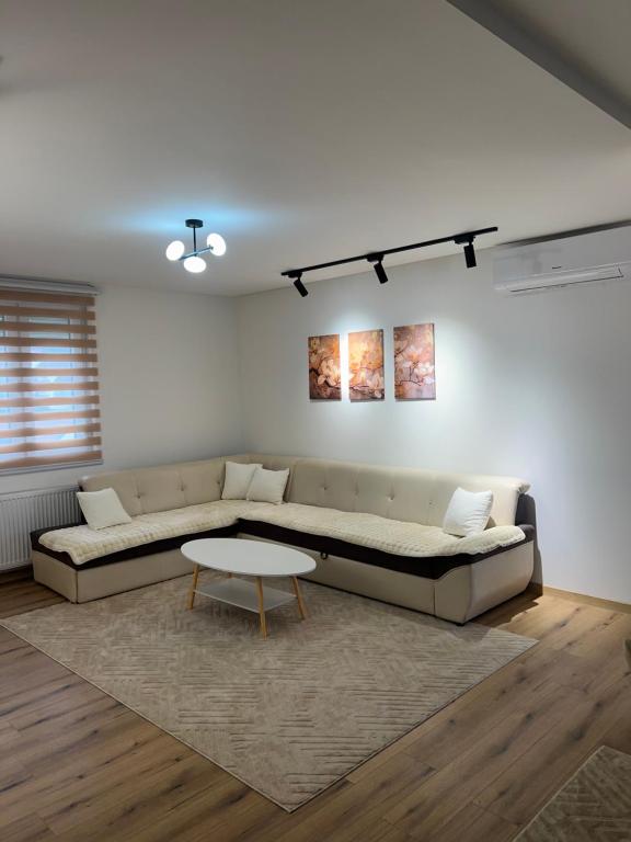 a living room with a couch and a table at Stan na dan Stanojević in Bratunac