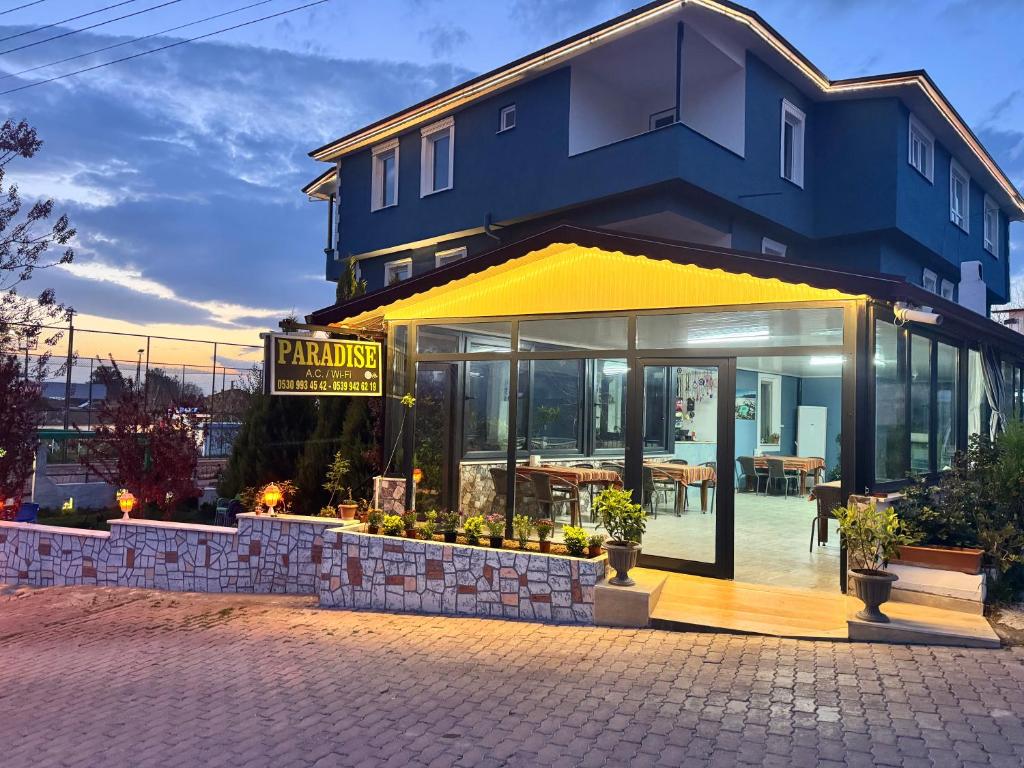 a building with a sign that reads pharmacy at Paradise House in Pamukkale