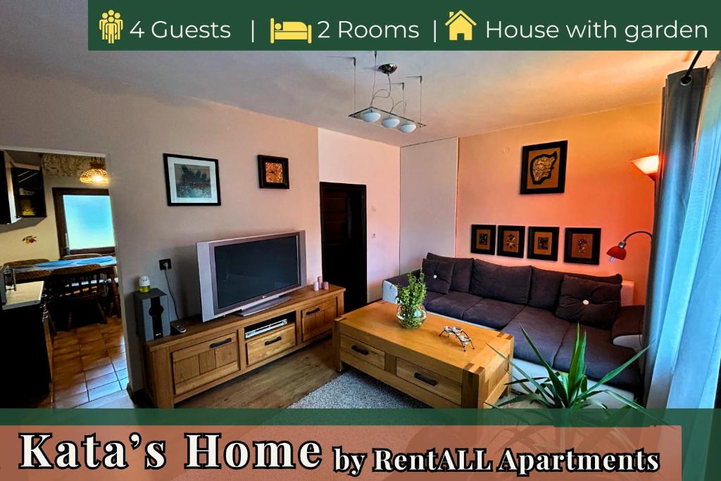 a living room with a couch and a tv at Kata Home by RentALL in Gheorgheni