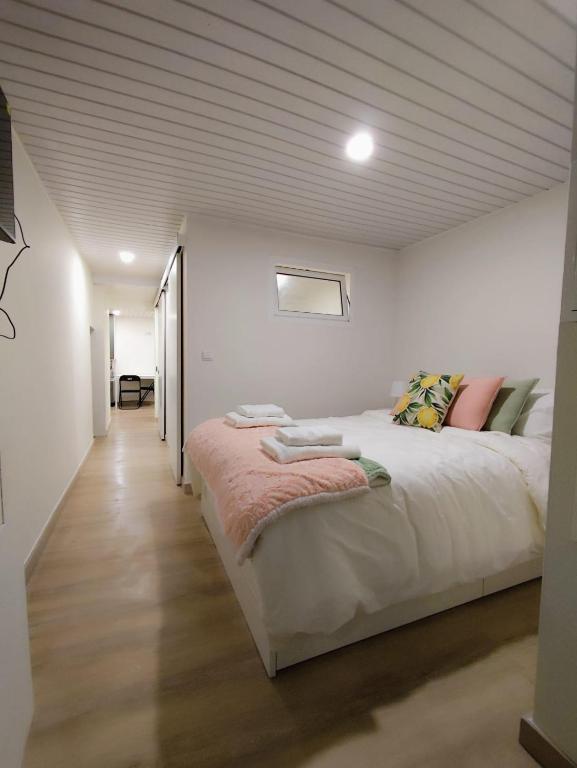a bedroom with a large bed in a room at Cantinho do Corgo in Vila Real