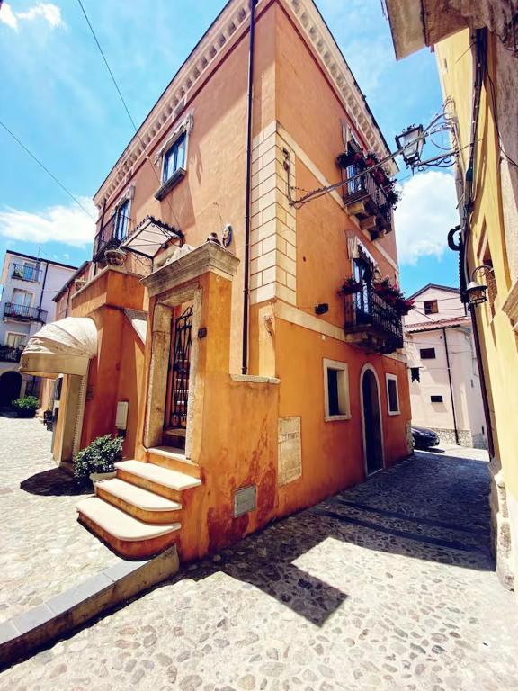 a building with stairs on the side of it at Caterina House in San Lucido