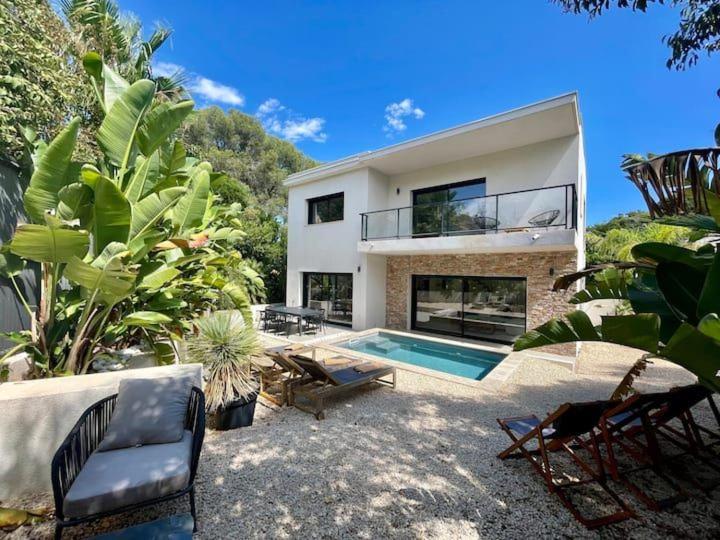a house with a swimming pool in front of it at Enjoy 5Bdr villa pool and BBQ in Saint-Raphaël