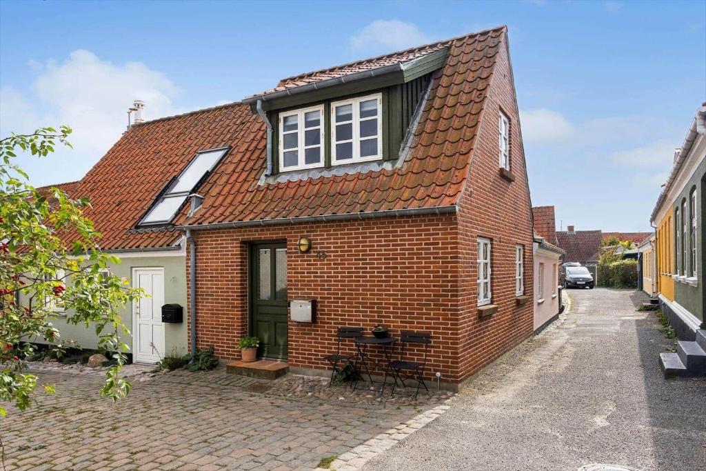 a brick house with a window on a street at AE318-Marstal-Faergestraede-45 in Marstal
