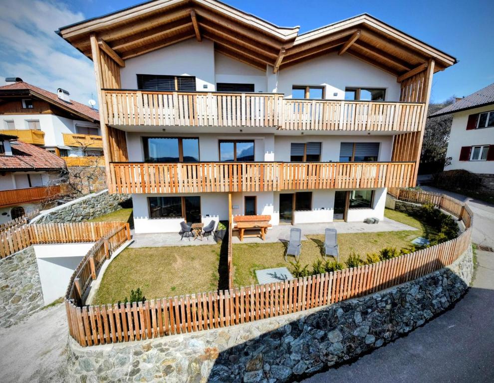 an image of a house with a balcony at SiLENA Dolomites in Laion