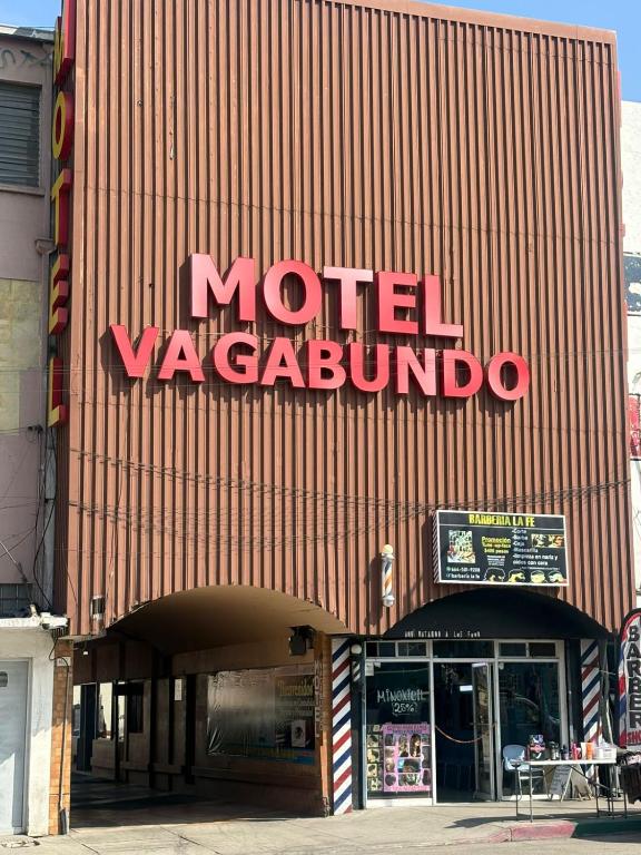 a building with a sign on the side of it at Hotel Vagabundo in Tijuana
