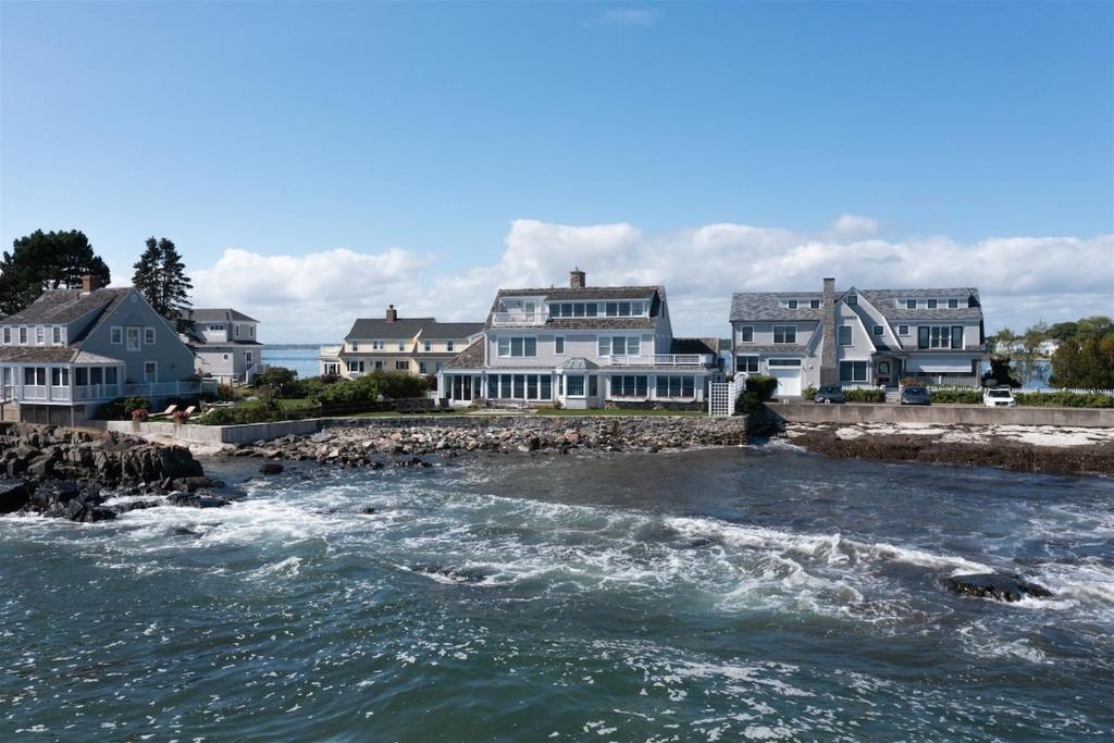 a view of a river with houses in the background at Mother`s Beach House in Kennebunk