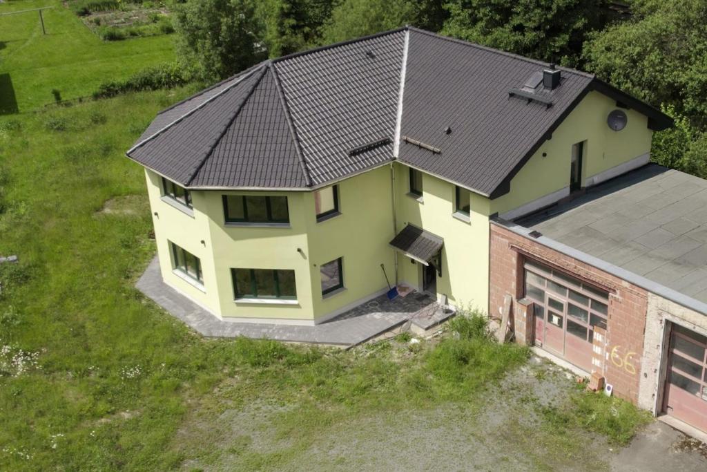 an overhead view of a house with a black roof at Ferienwohnung an der Zwota in Klingenthal