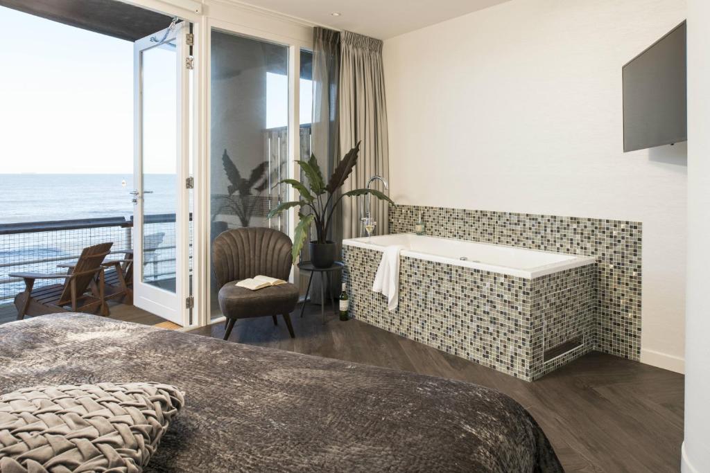 Postel nebo postele na pokoji v ubytování De Pier Suites