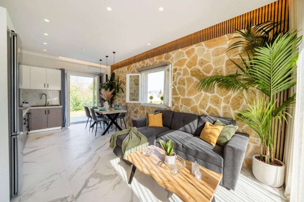 a living room with a couch and a table at Villa Renata in Kontokali
