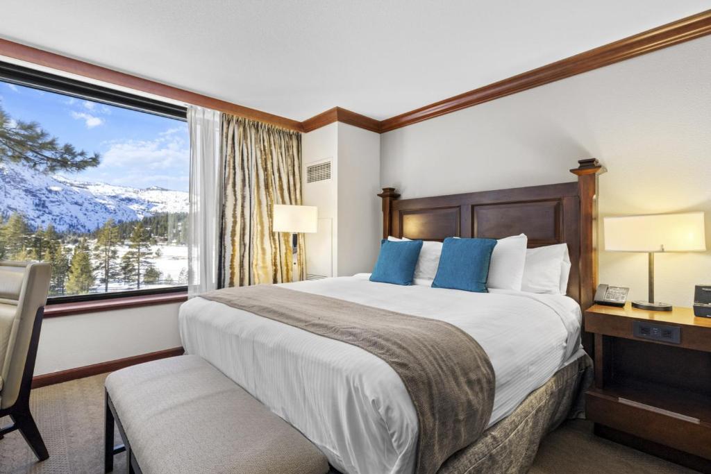 a bedroom with a large bed and a large window at Valley-View Unit in Everline Resort: Premier Perks in Olympic Valley
