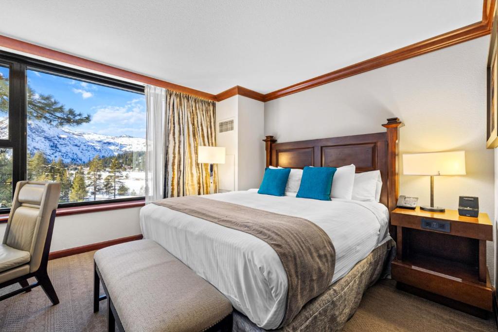a hotel room with a bed and a window at High Sierra Summer Stay in Everline Resort & Spa! in Olympic Valley