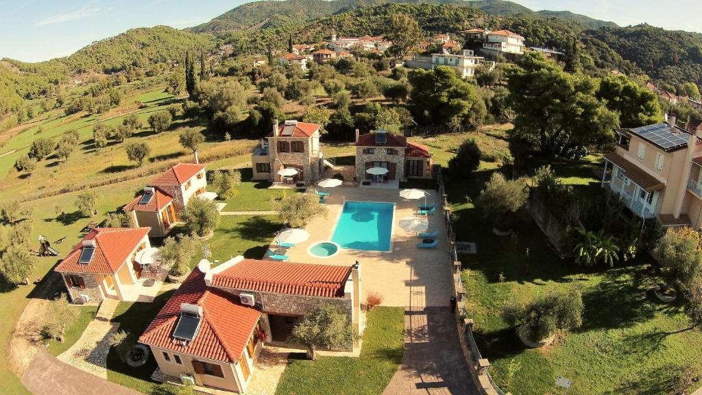 an aerial view of a house with a swimming pool at Evinos Garden in Tríkorfon