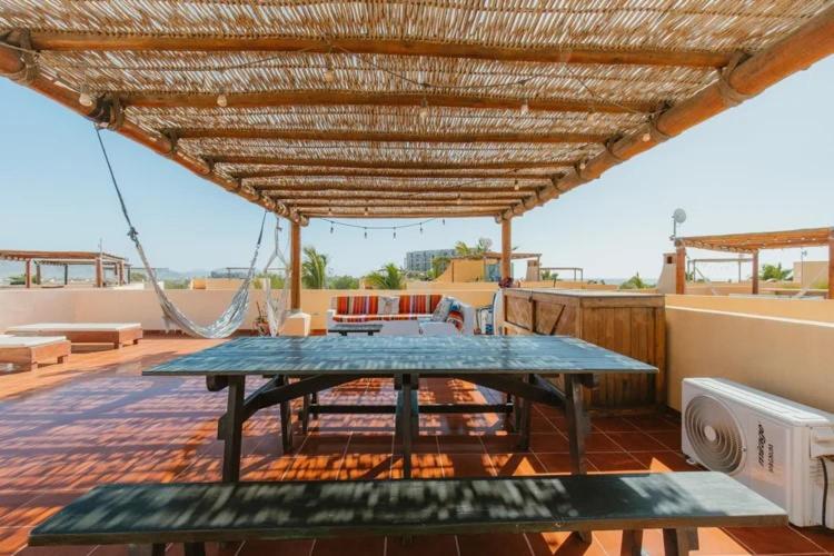 a patio with a picnic table on a roof at Baja Beach Pad at Cerritos in El Pescadero