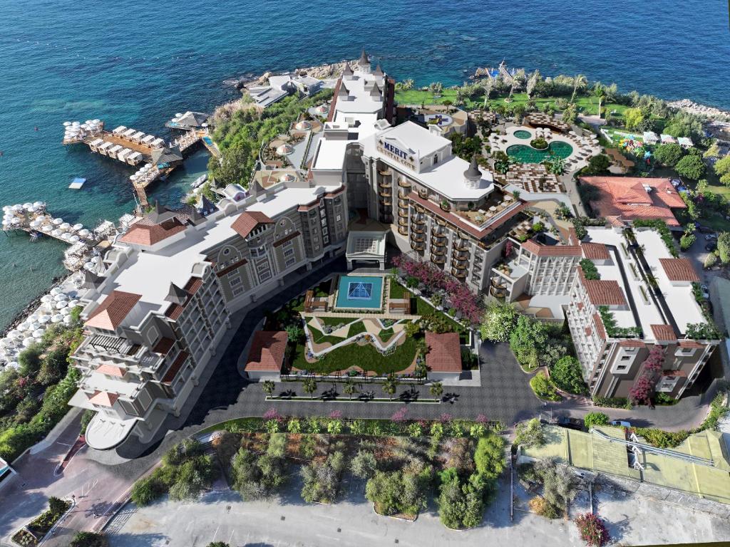 an aerial view of a resort on the ocean at Merit Crystal Cove Hotel Casino & SPA in Kyrenia