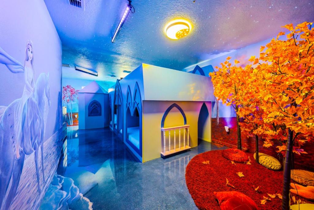 a room with a room with a wall with a mural at Windsor Resort Private Pool & Theater Game Room in Davenport