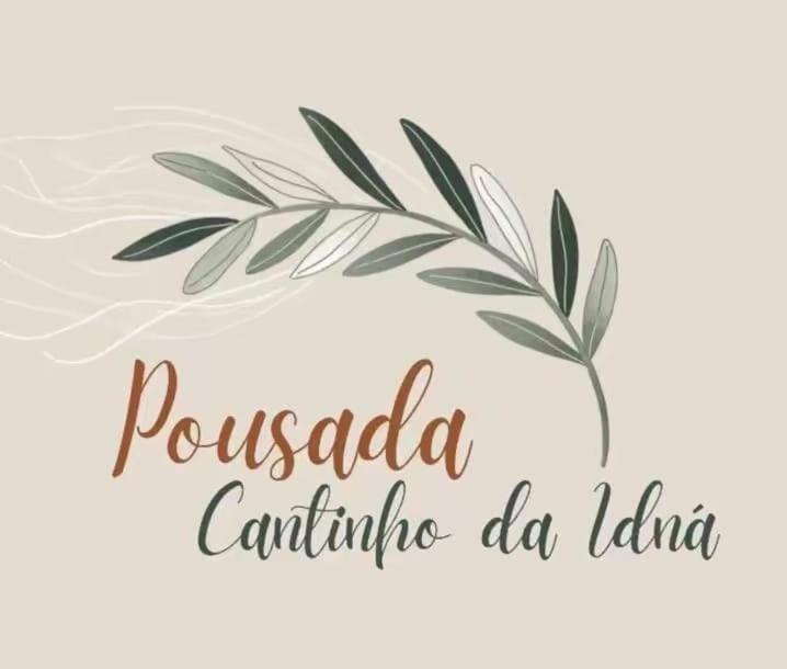 a logo for a dominicanican restaurant with a palm branch at Pousada Cantinho da Idná in Uberlândia