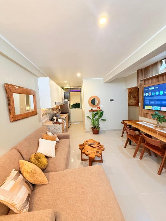 a living room with a couch and a table at Estancia Dorada in San Ramón