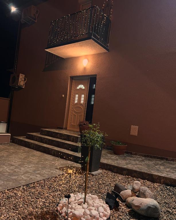 a building with a door with a candle in front of it at Vila Biva in Vrčin