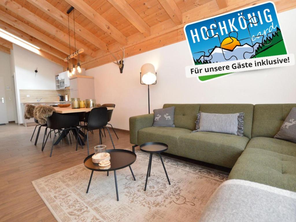 a living room with a couch and a table at Emma Top 4 in Dienten am Hochkönig