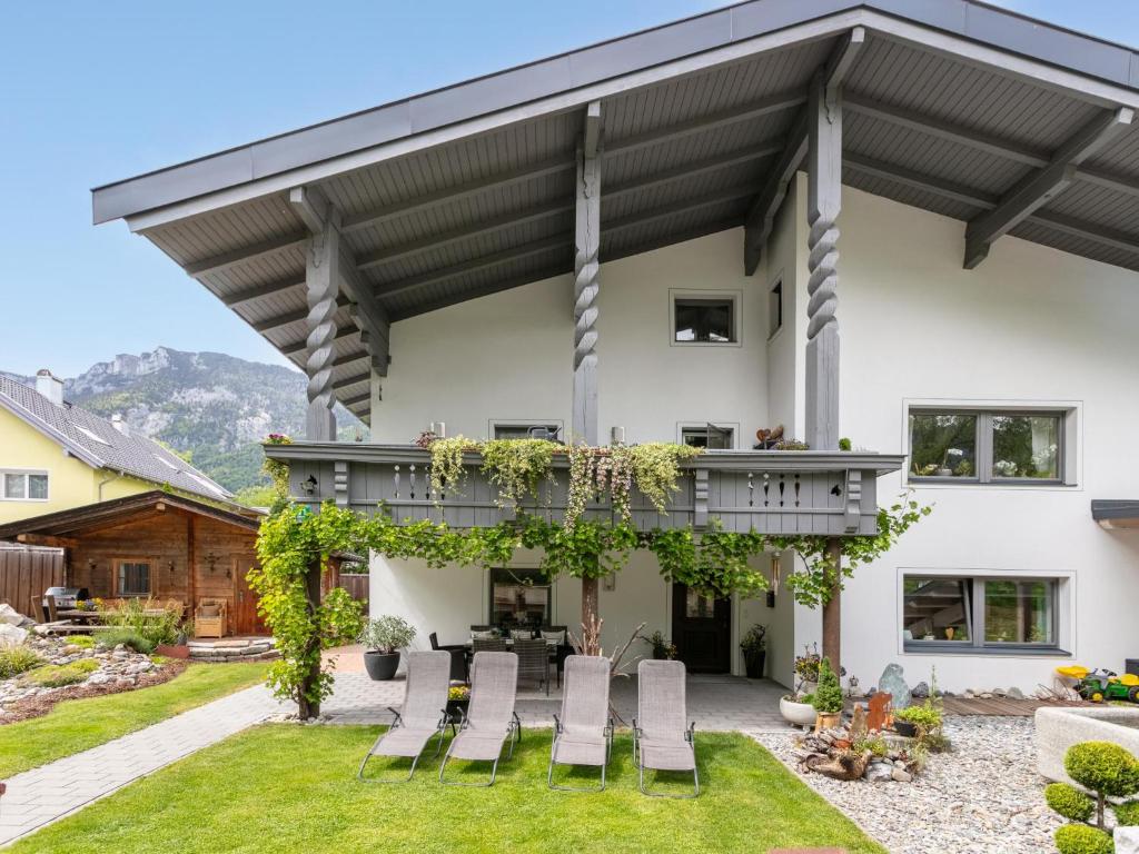 a house with a balcony and a patio at Am Inn Fluss in Langkampfen