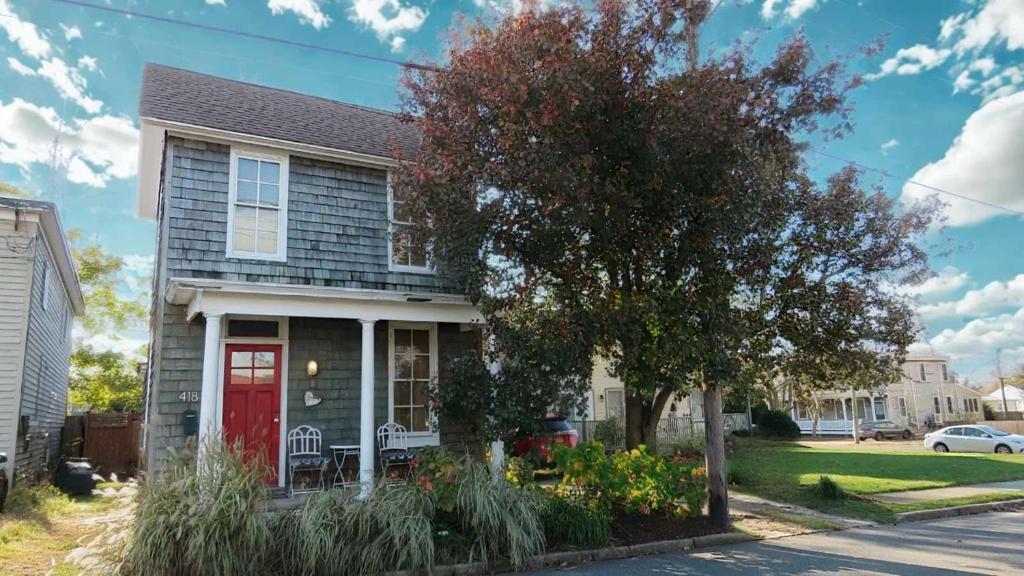 a house with a red door on a street at The Elmira Escape in Cape May