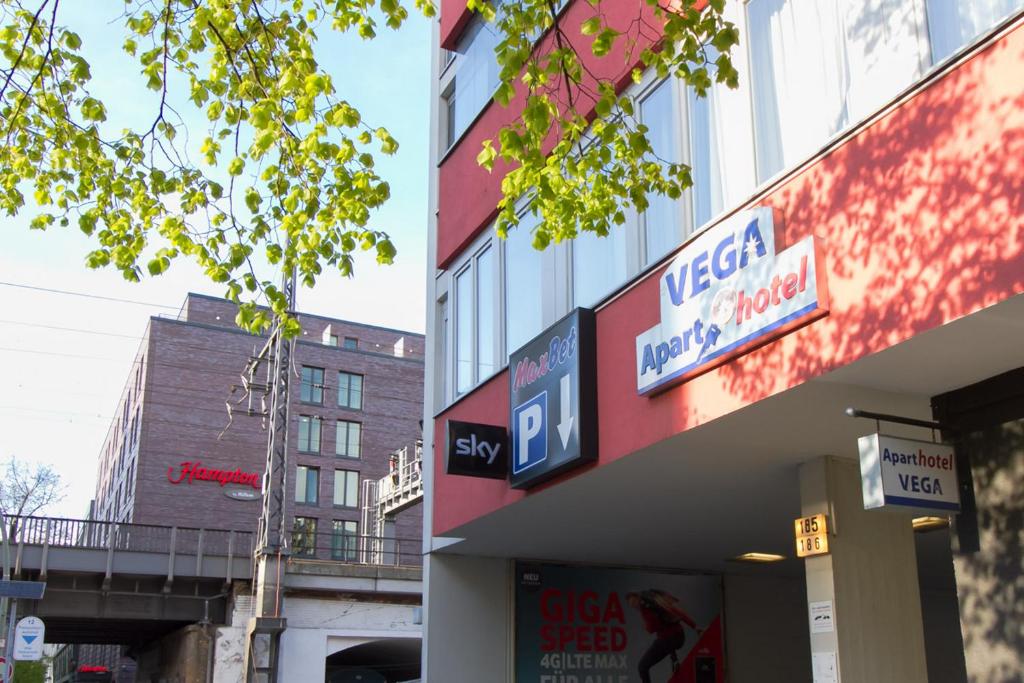 a building with a sign for a mexican music motel at Aparthotel VEGA in Berlin