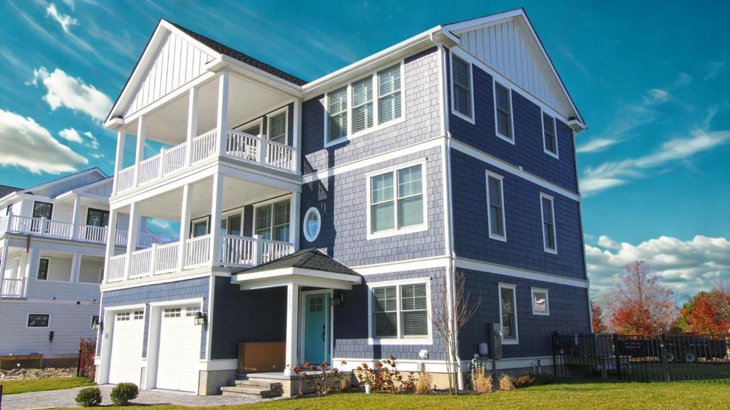 a large house with a blue and white at Seashell Sanctuary in Cape May