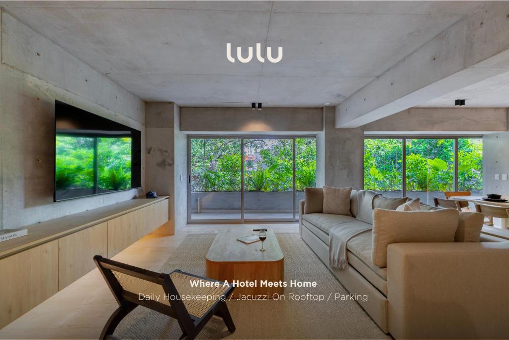 a living room with a couch and a table at Lulu Condesa by Capitalia in Mexico City