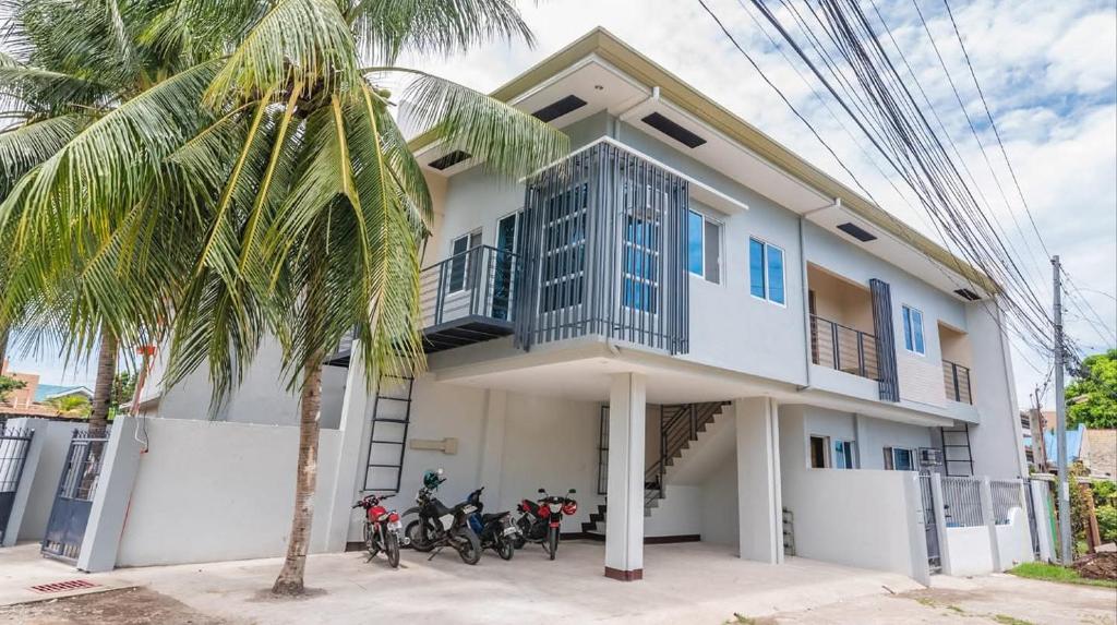 a house with bikes parked in front of it at Boboy's Guest House in Daro