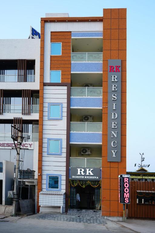 a building with a sign in front of it at RK Residency in Tirupati