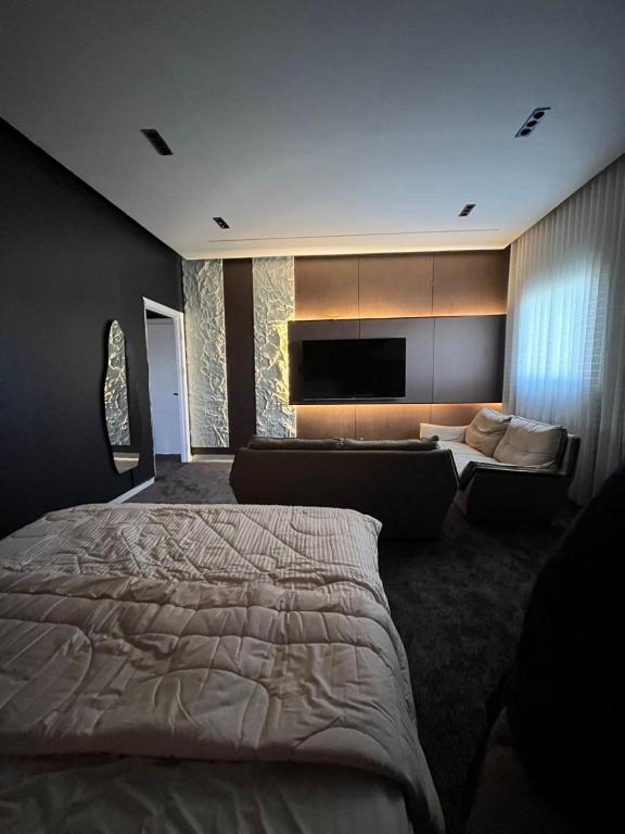 a bedroom with a large bed and a couch at Safety house in Tabuk