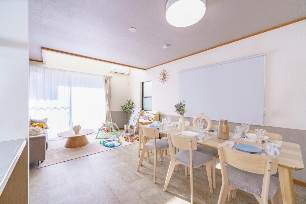 a dining room with a table and chairs at Nagoya Homestay in Nagoya