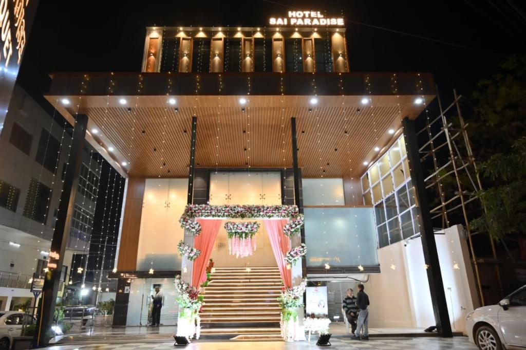 a building with a staircase with a christmasreath on it at Hotel Sai Paradise in Lucknow