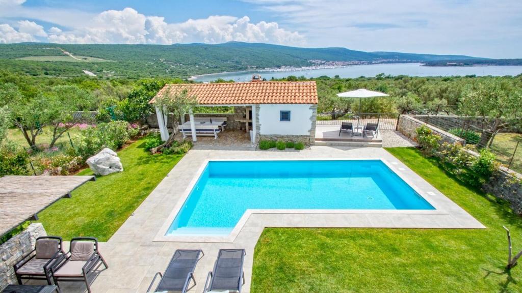 an image of a villa with a swimming pool at Villa Estate 2 by Villas Guide in Kornić