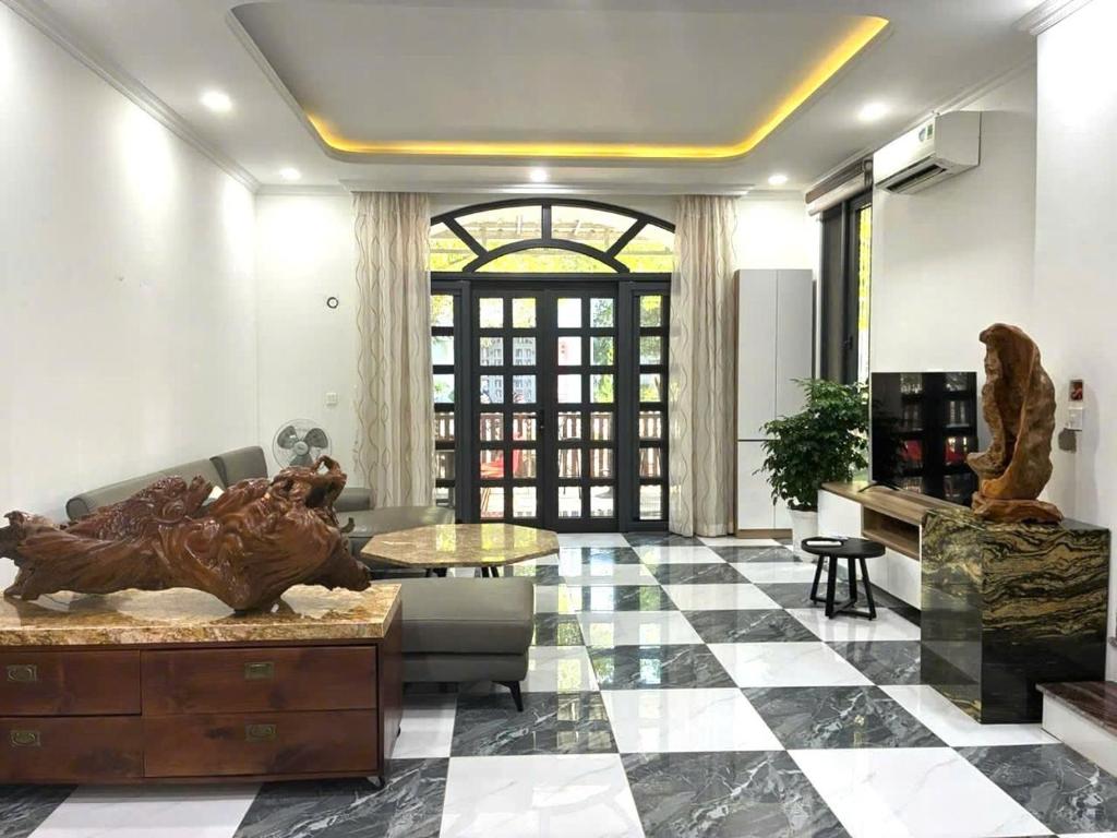 a living room with a statue in the middle of the room at Canisa Villas in Phú Quốc