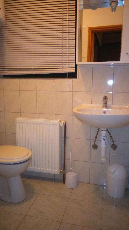 Kúpeľňa v ubytovaní Apartments T&M