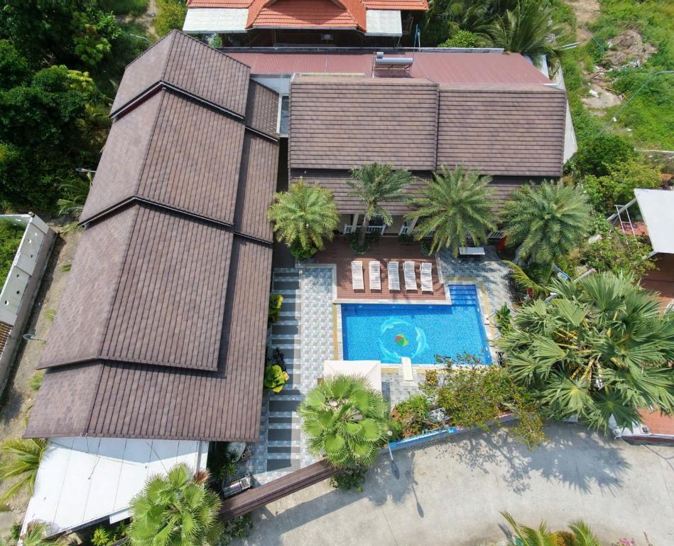 an aerial view of a house with a swimming pool at The Palm Phu Quoc Resort & Villa in Phú Quốc