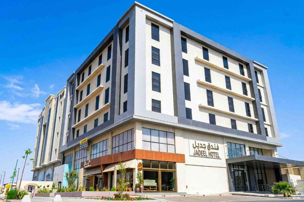 a large white building with a lot of windows at فندق جديل2 - Jadeel Hotel 2 in Al Khobar