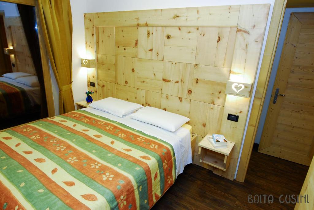 Postel nebo postele na pokoji v ubytování Residence Baita Cusini