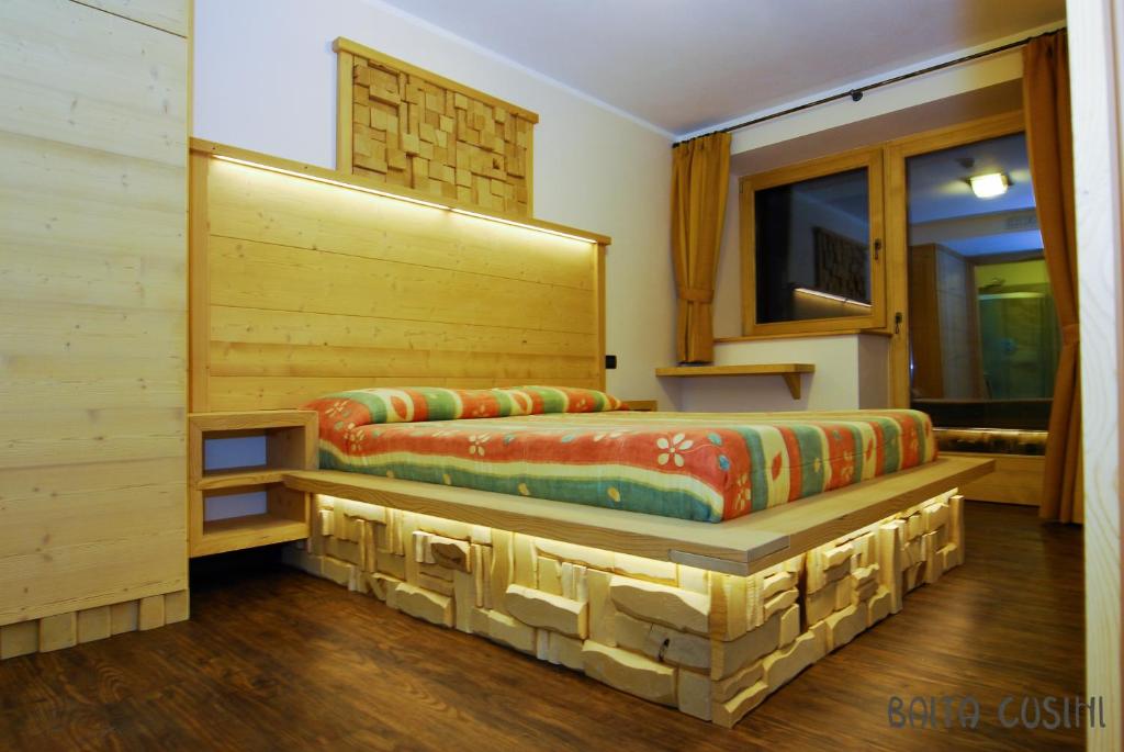Posezení v ubytování Residence Baita Cusini