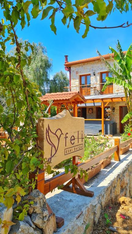 a sign for a hotel in front of a house at Feli Eski Datca Adult Only in Datca