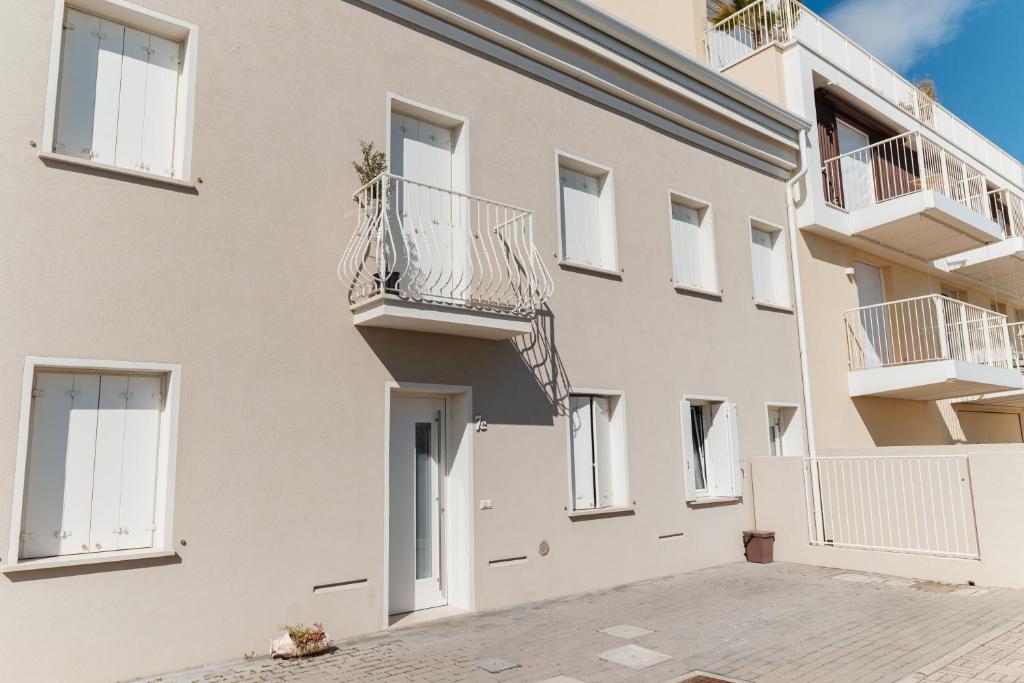 a building with balconies on the side of it at Villa AMARE in Caorle