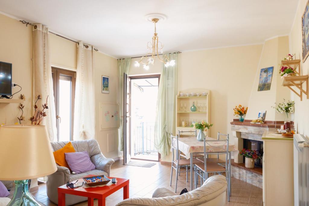 a living room with a couch and a table at La Casa dei Panorami in Castelsaraceno