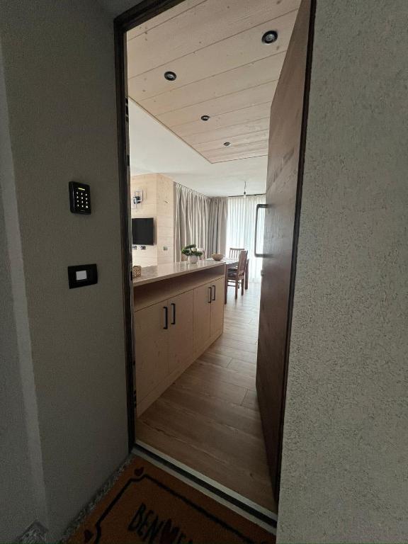 a kitchen with a hallway leading to a dining room at BORMIO Apartment AL PRADAIS in Bormio